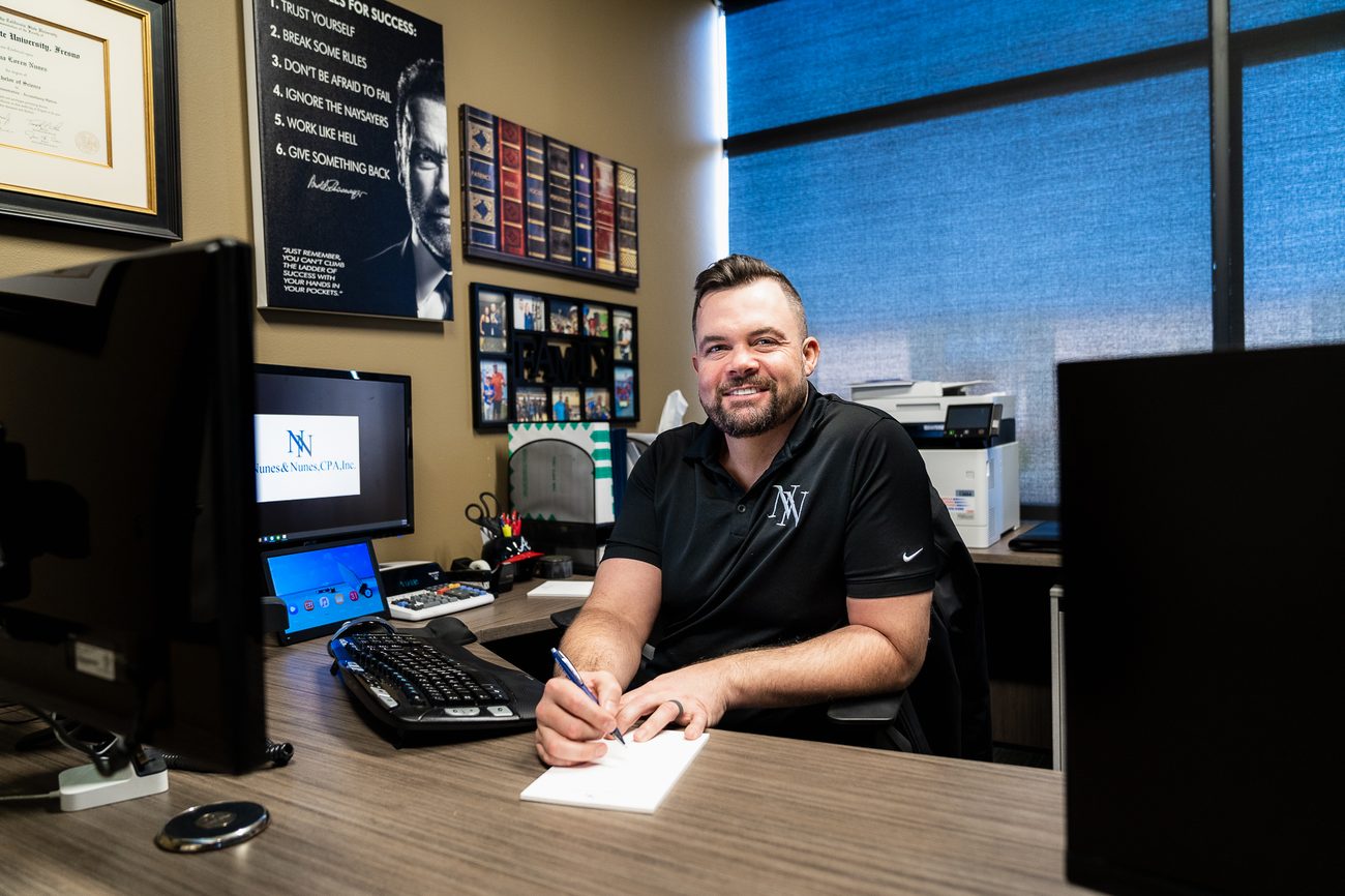 Joshua Nunes, CPA, working with a client at the Nunes & Nunes office